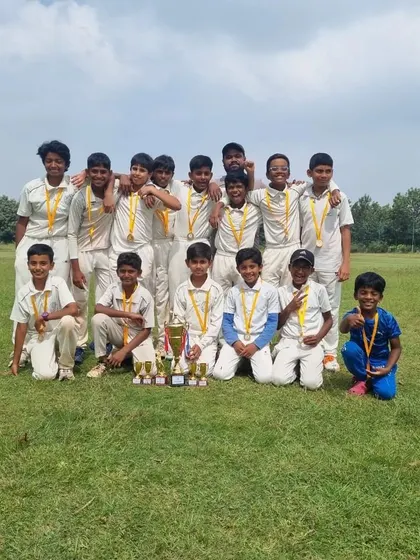 Champions! The entire U-12 team poses with their medals and trophies after winning the CBT championship, a testament to their collective effort and skill.