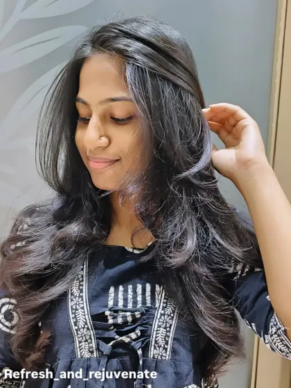 A final shot of the layered haircut, showing off its healthy shine and perfect styling.
