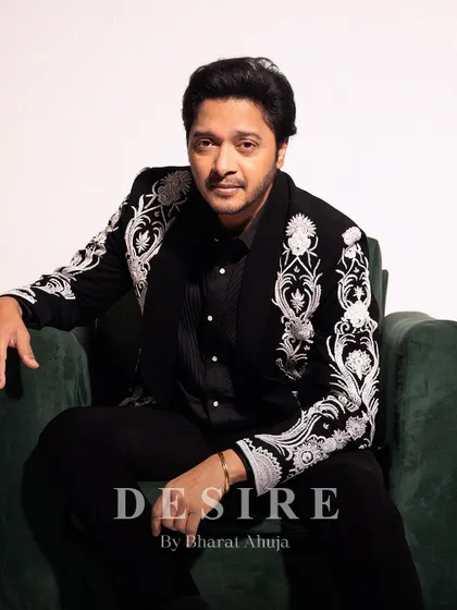 Confidence, tailored. Here, actor Shreyas Talpade wears a bespoke ceremonial jacket I designed. The sharp, modern fit is contrasted with powerful white embroidery on a classic black base, creating a look of pure, unapologetic elegance.