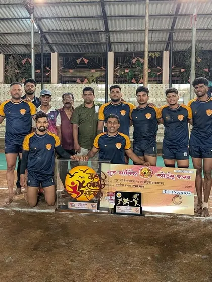 The team with the runners-up trophy, showing sportsmanship and determination.