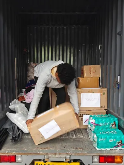 The final step: loading the carefully packed boxes of relief supplies onto a truck, ready to be delivered to those in need.