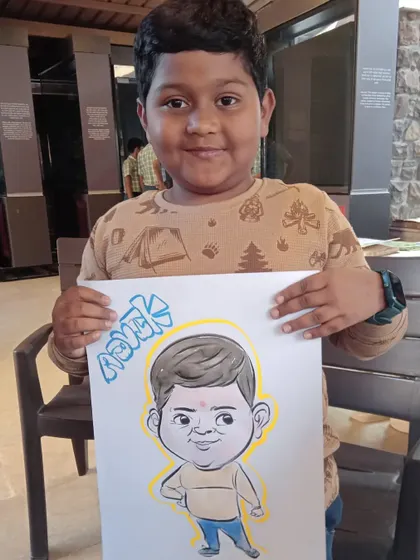 This young man, Ashank, looks very proud of his full-body caricature. I love capturing the playful energy of my younger clients.