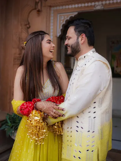 Another angle of the couple's candid laughter, showcasing their natural chemistry and the happiness of the moment.
