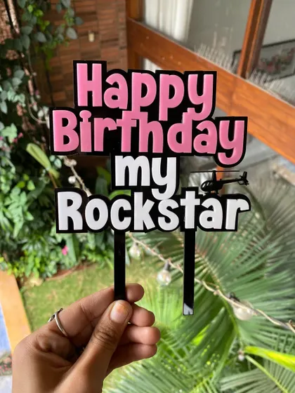 A clear shot of our "Rockstar" acrylic topper. The layered design gives it a great 3D effect that stands out on any cake.