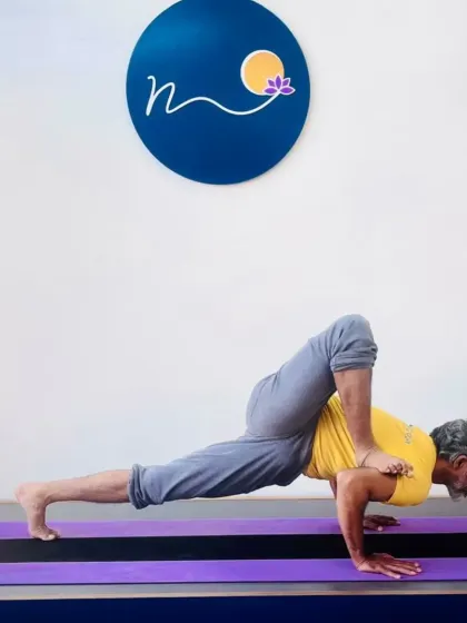 This is a variation of Eka Pada Koundinyasana II, a challenging arm balance that requires a strong core and open hips. My workshops focus on the step-by-step progression to achieve such demanding asanas.