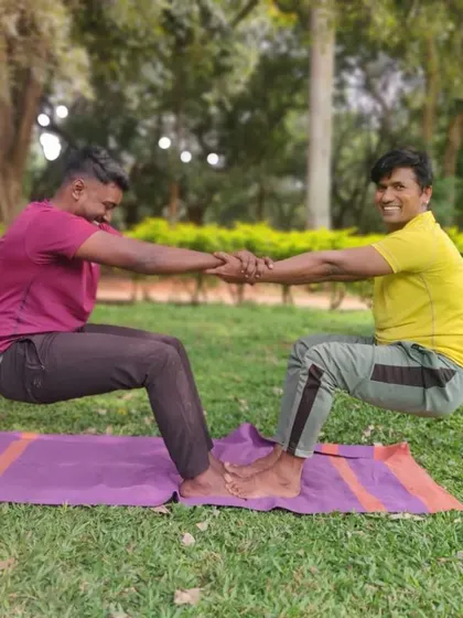 A classic partner pose that looks like we're floating. This requires immense core strength and counter-balance from both of us. It’s a great exercise in mutual support.
