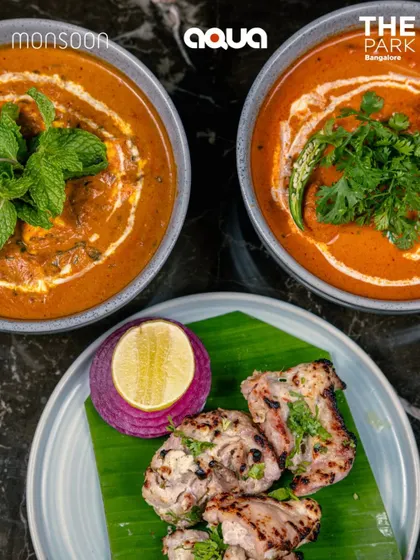 A comforting meal of creamy curries and succulent malai chicken tikka, showcasing the rich flavors of our Indian menu.