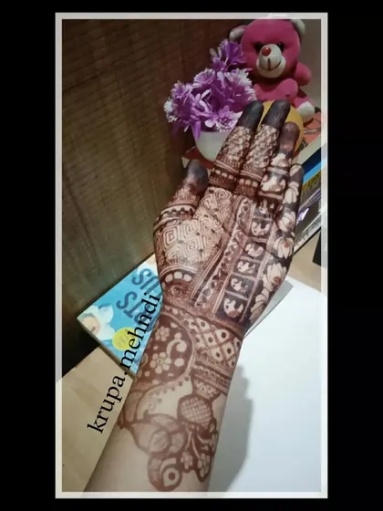 Another look at a detailed bridal mehndi design, featuring elephant motifs and intricate checkerboard patterns. This is the kind of art that makes your wedding photos unforgettable.