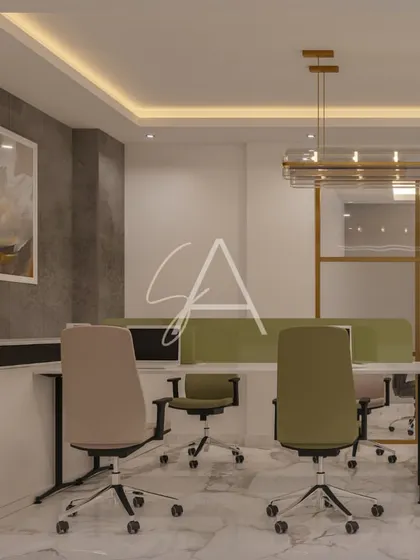 A shared workspace area with low green partitions for semi-privacy. The design uses a mix of concrete-textured walls and warm lighting to create a modern yet comfortable work zone.