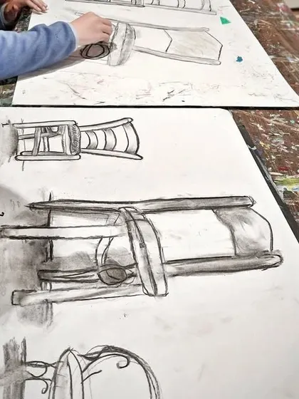 Here, young students practice observational drawing by sketching lanterns. This exercise helps them understand perspective, shape, and shading in a hands-on and engaging way.
