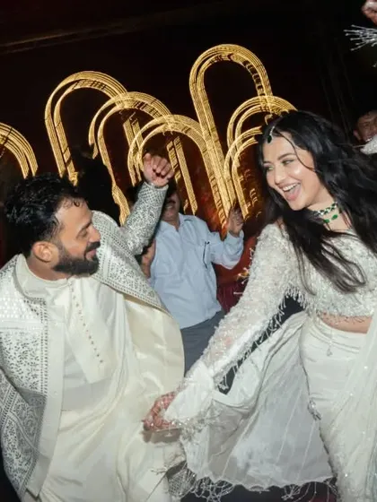 The bride and groom letting loose and having the time of their lives on the dance floor.