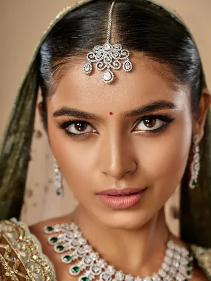 A direct, powerful gaze. This image highlights the beautifully defined eyes and the clean, radiant skin that forms the base of this stunning bridal makeup.