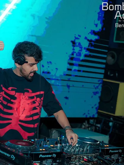 A thumbs-up from the booth at Bombay Adda. The skeleton shirt adds a bit of edge to the high-energy Bollywood night.