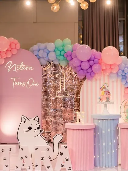 A purr-fectly adorable cat-themed "Paw-ty" for a first birthday. We used a soft pastel color palette, cute cat cutouts, and a touch of sparkle.