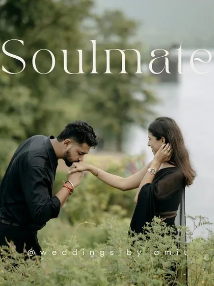 "Soulmate." A simple word for a powerful photo. A groom-to-be kisses his partner's hand in a field of green, a truly romantic pre-wedding portrait.