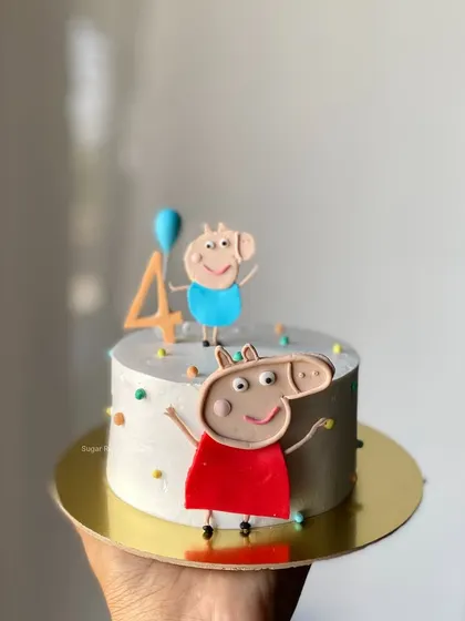 A cute and simple Peppa Pig mini cake for a 4th birthday. It's the perfect size for a small celebration, featuring Peppa and her brother George.