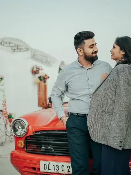 Add a touch of classic Bollywood romance to your shoot with our vintage red convertible. It's one of the many props, like Jeeps and pianos, that we provide to make your photos fun and unique.