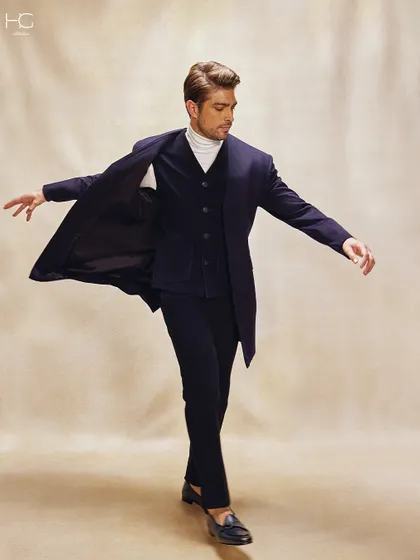 This image captures the movement and flow of a tailored corduroy and cashmere trench coat. It’s a fresh take on texture that provides effortless sophistication.