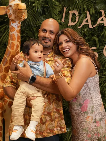 A beautiful family portrait amidst the fun of the party. Even during a busy event, I find moments to capture the core of the celebration: family. Here are Idaan's proud parents with the birthday boy.