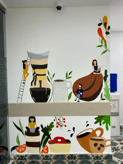 The finished coffee-themed mural at Dhruva Advisors. The client joked that I should just write "permanent coffee break" on the wall because the vibe was so relaxing!