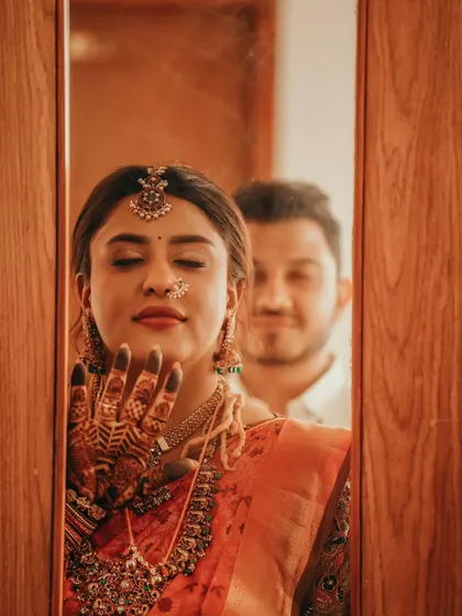 Another mirror shot, capturing the bride's reflection and her beautiful henna stain.