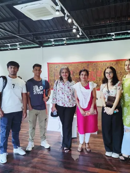 Our director and faculty with a small group of students at the Craft Village art gallery.