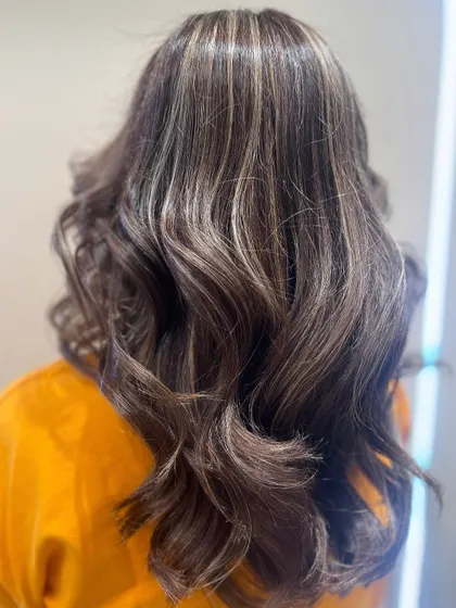 Another look at these beautiful ash blonde highlights, showing how the color catches the light and creates incredible dimension.