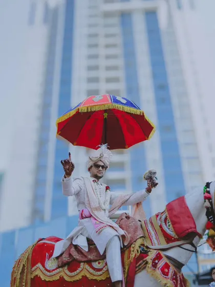 A duplicate of the groom's grand arrival on horseback.