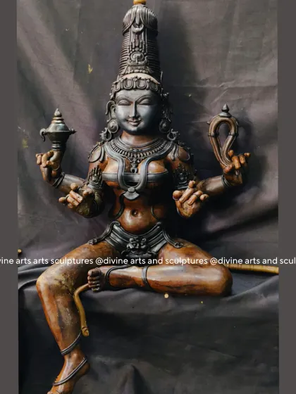 This is the wax model for a sculpture of Raja Rajeshwari, the "empress of all worlds." Her divine and regal presence is captured in the wax, from her seated posture to the symbolic items in her hands.