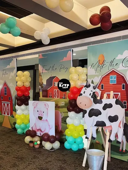 Fun and interactive game stalls for the barnyard party, including 'Milk the Cow' and 'Feed the Pig'.
