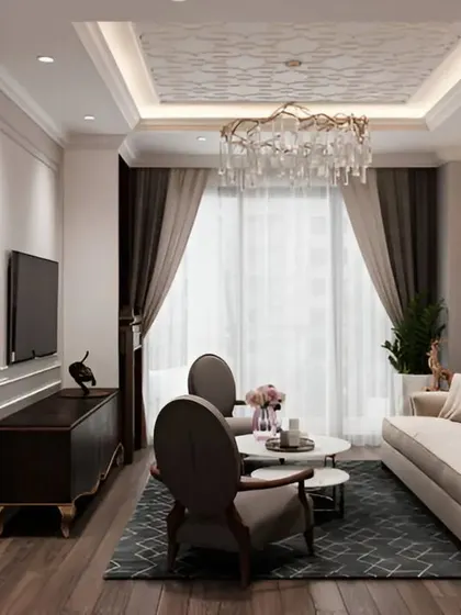This angle highlights the room's thoughtful lighting design, including wall sconces and a detailed tray ceiling with cove lighting.