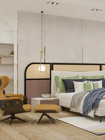 A comfortable reading chair in a warm tan leather finish adds a cozy corner to this stylish and modern bedroom.