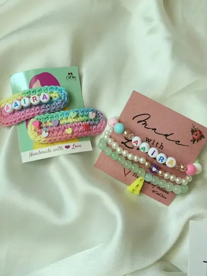 The perfect personalized combo! This set features our rainbow crochet name clips and a matching stack of beaded name bracelets for Aaira.