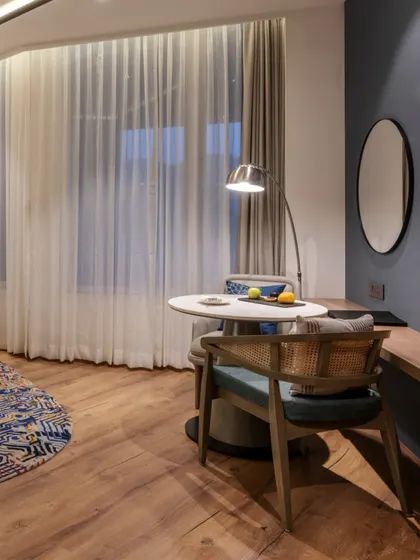 Additional views of the Radisson Resort, Khopoli, showcasing various interior and exterior details, from lobby seating areas and restaurant layouts to guest room configurations and architectural elements.