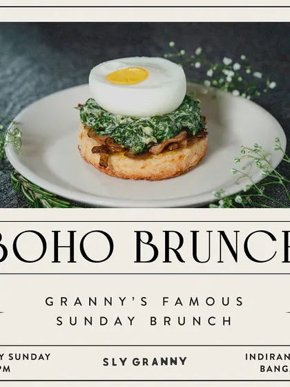 A perfectly poached egg on a bed of greens and a biscuit. This is brunch elegance, Granny style.
