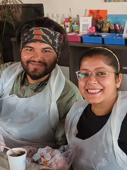 A happy couple at our workshop, showing off their peace signs and getting ready to dive into their resin art project. Our sessions are a great activity for dates, friends, and solo adventurers.