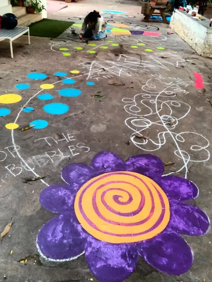 "Pop the Bubbles" and a giant hypnotic flower are just some of the playful elements in this floor mural, designed to spark imagination and encourage activity.