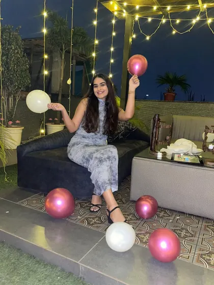 A guest enjoying the party. The rooftop offers plenty of comfortable seating and photo-worthy corners, ensuring everyone has a great time celebrating the bride-to-be.