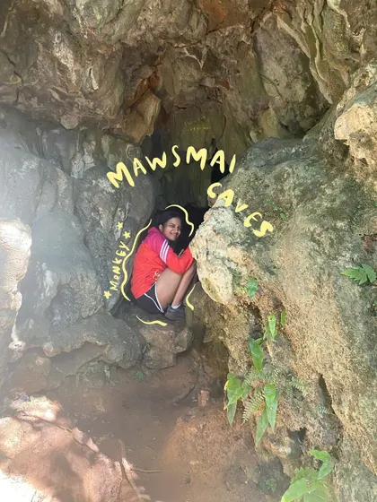 Feeling like a monkey in the Mawsmai Caves. The playful text doodle adds a bit of humor to this adventure shot.