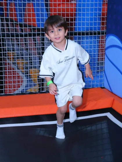 A young adventurer enjoying the bounce. Our trampolines are suitable for a wide range of ages, with staff on hand to ensure a safe play environment for everyone.