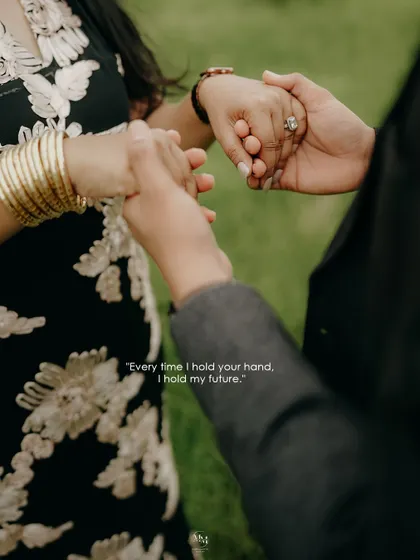 'Every time I hold your hand, I hold my future.' A close-up shot focusing on their intertwined hands, a powerful symbol of their commitment and shared destiny.