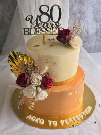 Celebrating eight decades is a monumental milestone. This "Aged to Perfection" cake was designed for an 80th birthday, combining elegant florals with warm, rich colors. It was an honor to create a cake that reflects a life full of wisdom, grace, and blessings.