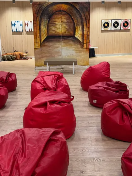 The setup for my storytelling session at the Prestige Centre for Performing Arts. I like to create a comfortable and informal atmosphere with beanbags and colourful backdrops, making it a cozy 'adda' for the kids to relax and listen.