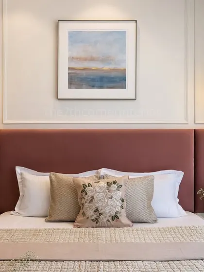 The wall art serves as a central focal point in this master bedroom, complemented by two elegant pendant lights. The composition elevates the room's decor, merging style with a tranquil atmosphere.