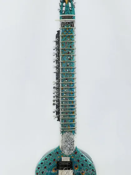 A full view of the stunning, fully decorated Peacock design sitar. This is a showpiece instrument that sounds as beautiful as it looks.
