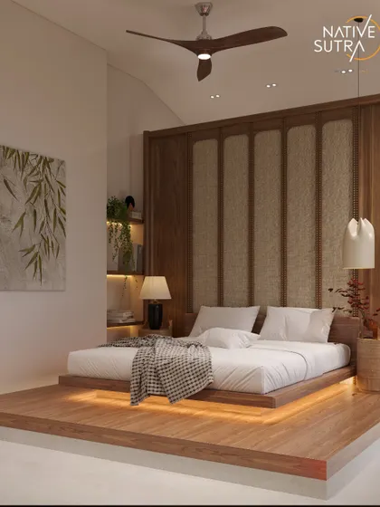 Another angle of the Japandi master bedroom, showcasing the elevated platform bed and the textural cane-panelled headboard. The warm, ambient lighting from beneath the bed adds to the room's serene, floating effect.