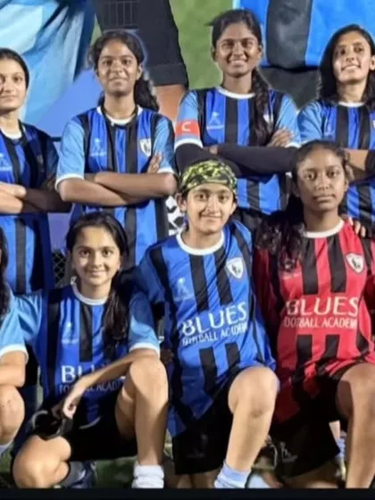 Our women's team stands together for a team portrait, a symbol of their unity and shared goals.