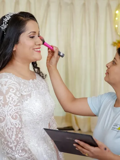 A candid shot of me applying blush to the bride. My goal is always to create a calm and happy environment, making the getting-ready process a memorable part of the day.