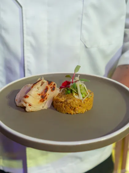 A duplicate of image 80, showcasing our modern take on a traditional grain-based dish. The plating is clean, contemporary, and focuses on the quality of the ingredients.