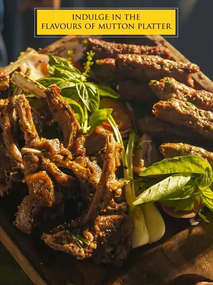 Our Mutton Platter is a testament to our culinary heritage. It features a selection of succulent, perfectly spiced mutton chops and seekh kebabs, grilled to perfection and served on a rustic wooden board, showcasing the rich flavors of our traditional recipes.